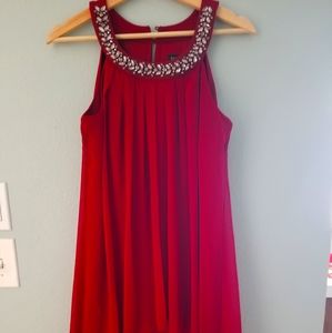 Red dress with rhinestone around neckline